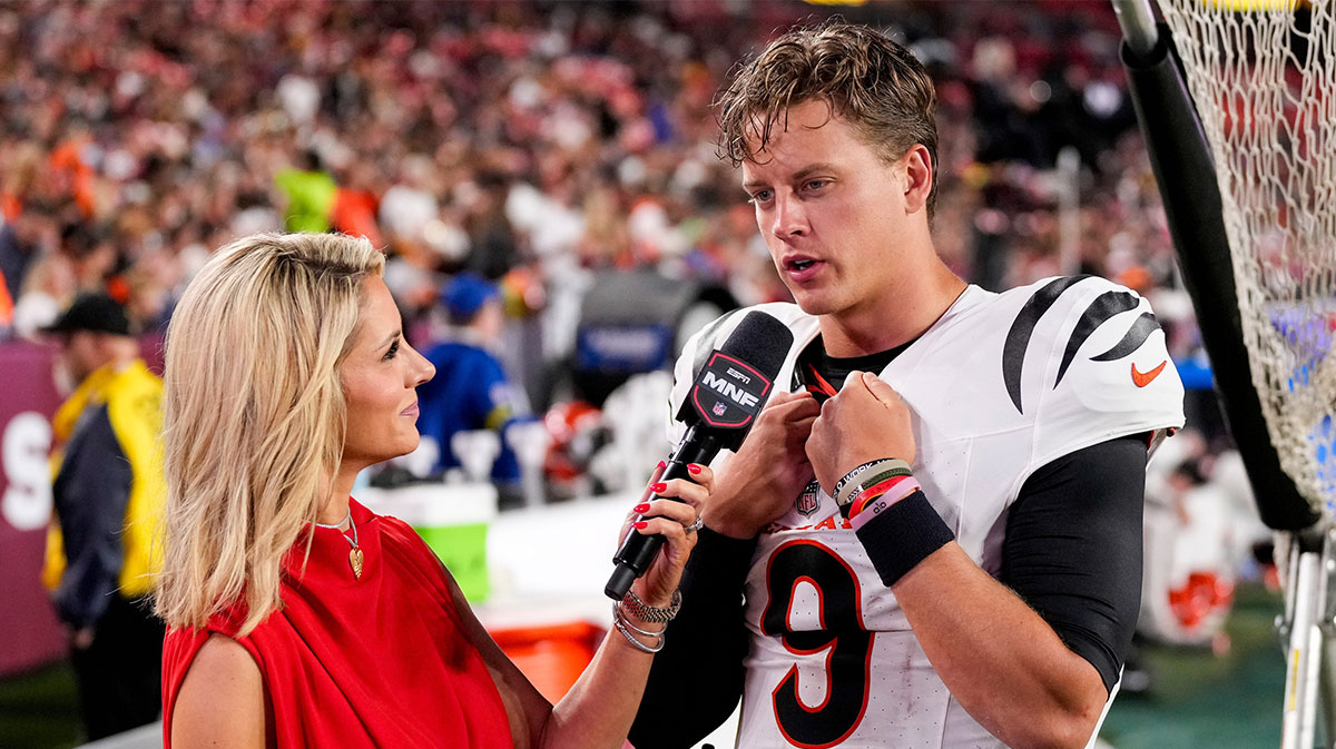 Cincinnati Bengals quarterback Joe Burrow (9) is interviewed by sideline reporter Laura Rutledge in the third quarter of the NFL Preseason Week 2 game between the Washington Commanders and the Cincinnati Bengals at Northwest Stadium in Landover, Md., on Monday, Aug. 18, 2025. The Bengals won the game, 31-17.