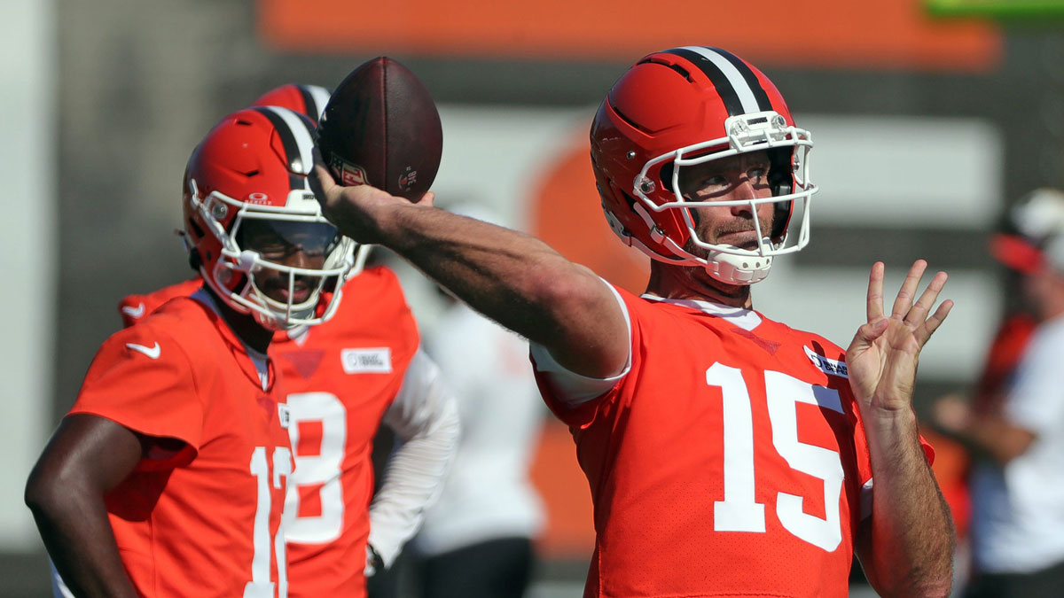 Cleveland Browns quarterback Joe Flacco (15) throws as quarterback Shedeur Sanders (12) looks on during a training camp practice July 23, 2025, in Berea, Ohio.