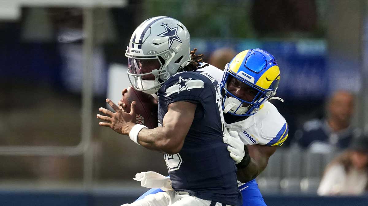 Dallas Cowboys quarterback Joe Milton III (10) is sacked by Los Angeles Rams linebacker Josaiah Stewart (41) in the first half at SoFi Stadium.