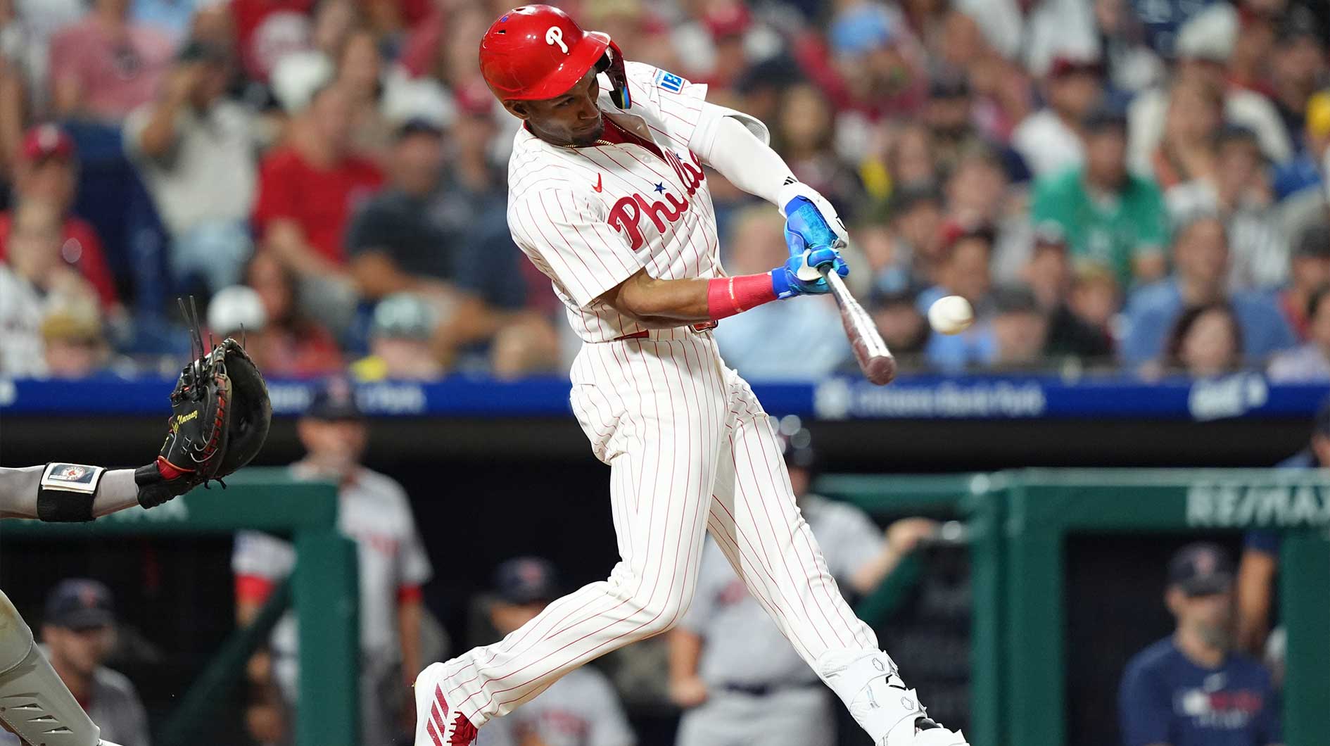 Philadelphia Phillies outfielder Johan Rojas (23) hits an RBI single against the Boston Red Sox in the eleventh inning