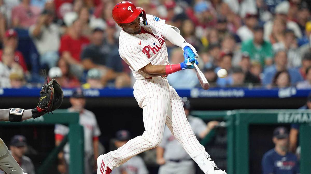 Philadelphia Phillies outfielder Johan Rojas (23) hits an RBI single against the Boston Red Sox in the eleventh inning