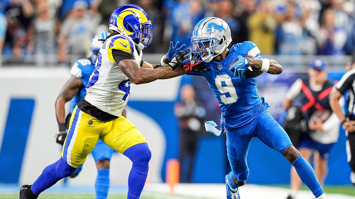 Detroit Lions wide receiver Jameson Williams (9) runs for a first down against Los Angeles Rams safety John Johnson III (43) during the first half at Ford Field in Detroit on Sunday, September 8, 2024.