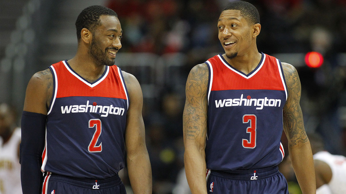 Washington Wizards guard John Wall (2) talks to guard Bradley Beal (3) against the Atlanta Hawks in the third quarter in game four of the first round of the 2017 NBA Playoffs at Philips Arena.