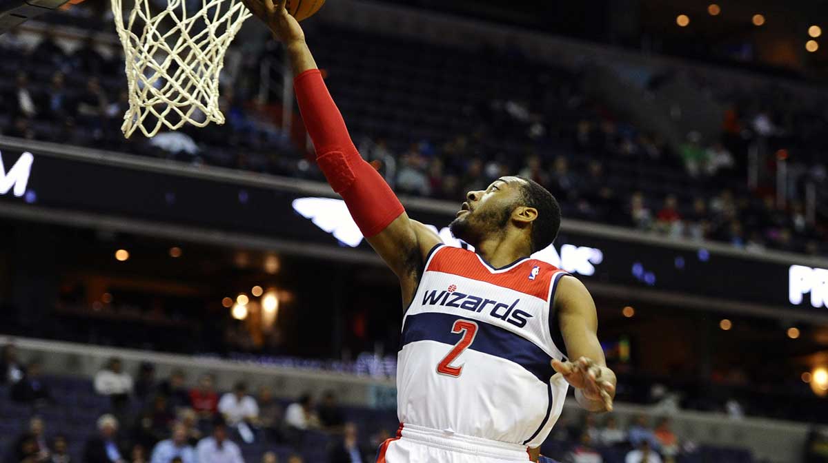 Washington Wizards point guard John Wall (2) shoots a layup against the Charlotte Bobcats during the first half at Verizon Center. 