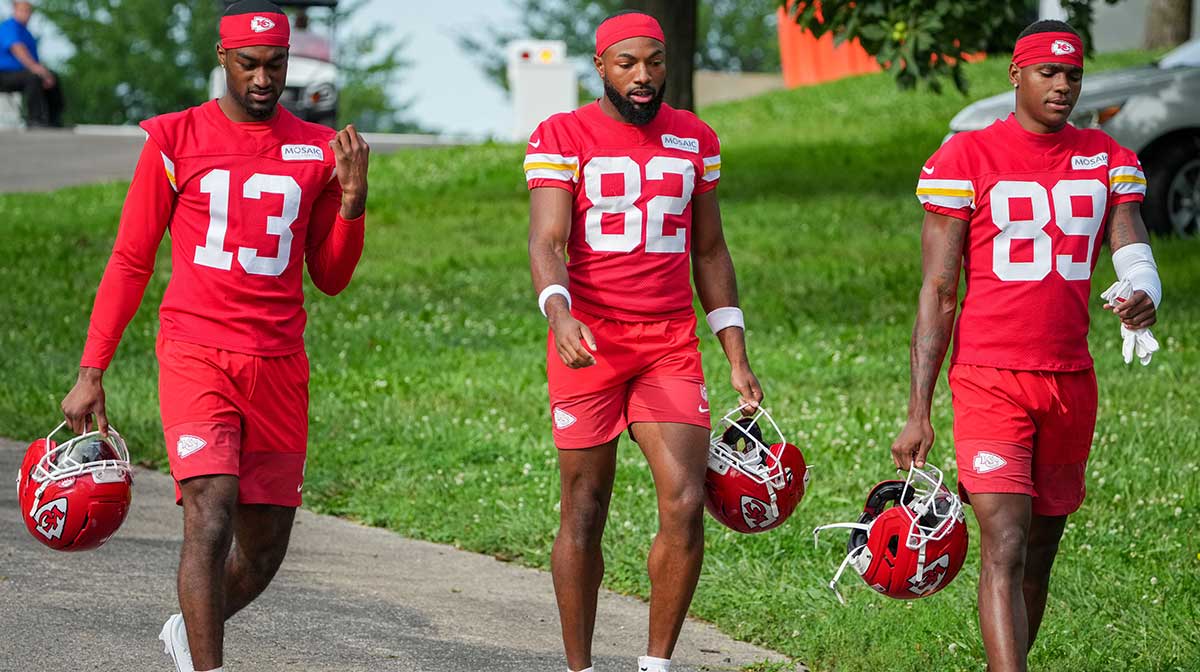Kansas City Chiefs safety Nazeeh Johnson (13) and wide receivers Jimmy Holiday (82) and Jason Brownlee (89) walk down the hill to the practice fields during training camp at Missouri Western State University.