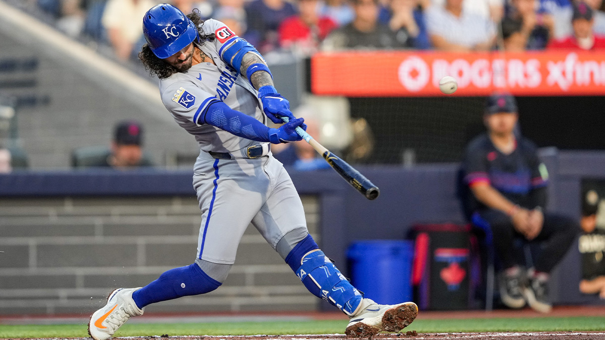 Aug 1, 2025; Toronto, Ontario, CAN; Kansas City Royals second base Jonathan India (6) hits a double against the Toronto Blue Jays during the third inning at Rogers Centre.