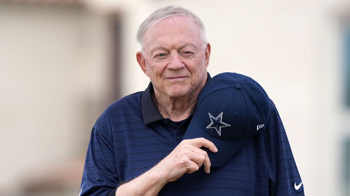 Dallas Cowboys owner Jerry Jones observe the playing of the national anthem at training camp opening ceremonies at the River Ridge Fields.