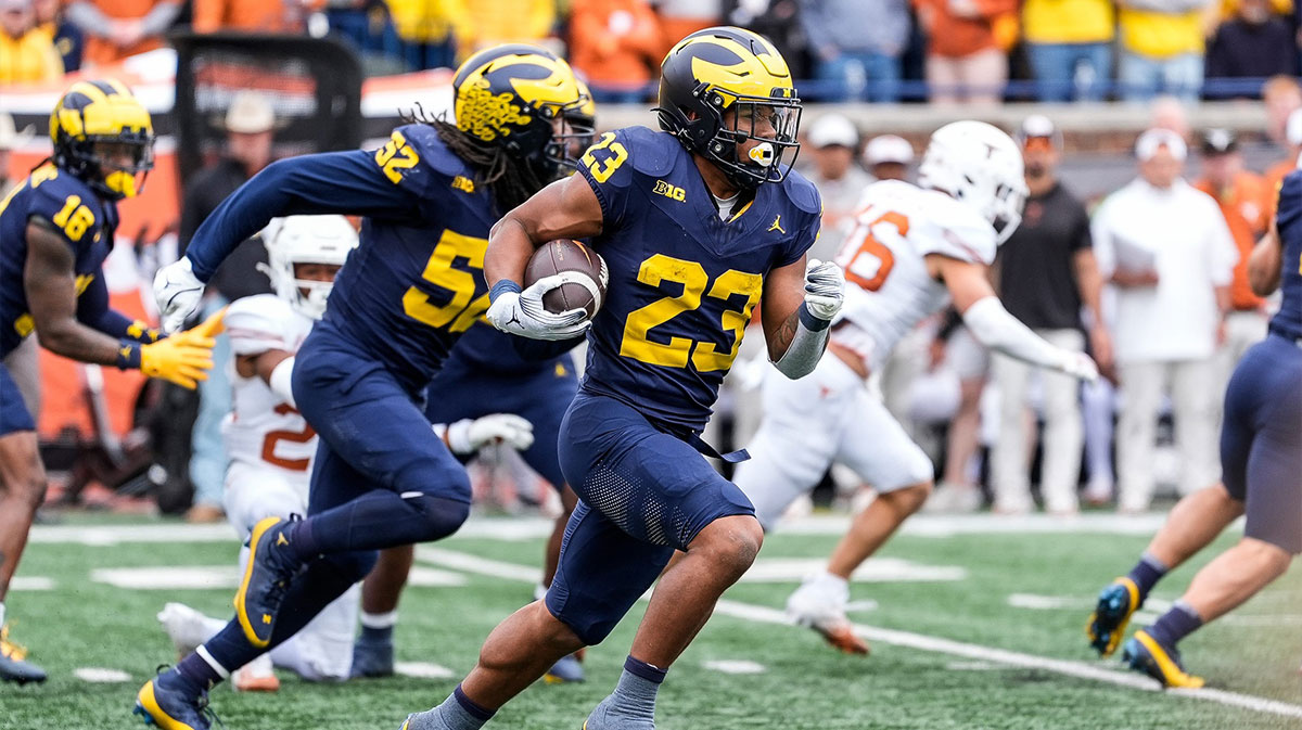 Michigan running back Jordan Marshall (23) returns a kickoff from Texas during the second half at Michigan Stadium.