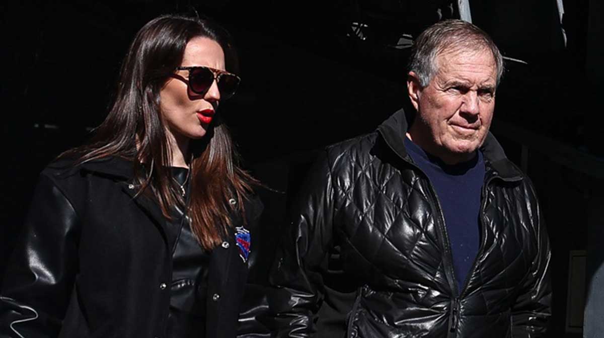 Former New England Patriots head coach Bill Belichick and girlfriend Jordon Hudson enter the field before the game between the Notre Dame Fighting Irish and the Navy Midshipmen at MetLife Stadium.