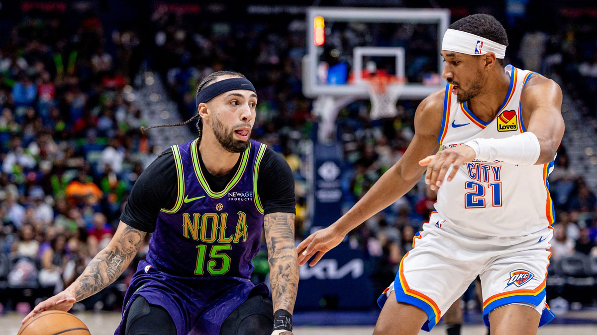 New Orleans Pelicans guard Jose Alvarado (15) dribbles against Oklahoma City Thunder guard Aaron Wiggins (21) during the second half at Smoothie King Center.