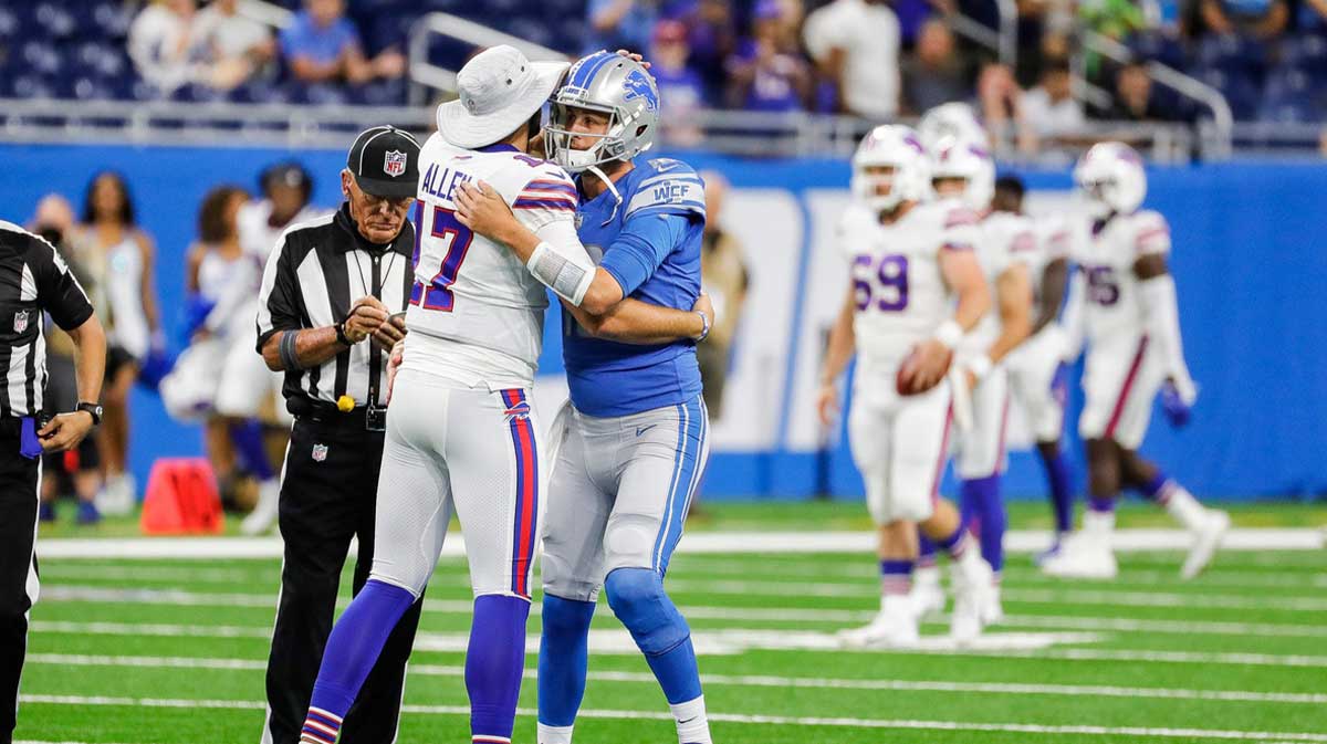 Lions quarterback Jared Goff hugs Bills quarterback Josh Allen at coin toss during the first half of the preseason game at Ford Field on Friday, Aug. 13, 2021.