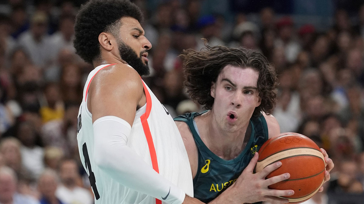Australia guard Josh Giddey (3) drives against Canada guard Jamal Murray (4) in a men's group stage basketball match during the Paris 2024 Olympic Summer Games at Stade Pierre-Mauroy.