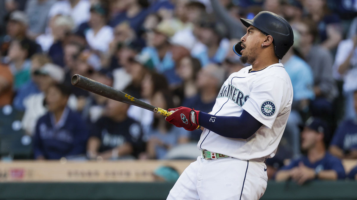 Seattle Mariners first baseman Josh Naylor (12) hits a two-run home run against the Seattle Mariners during the first inning at T-Mobile Park.