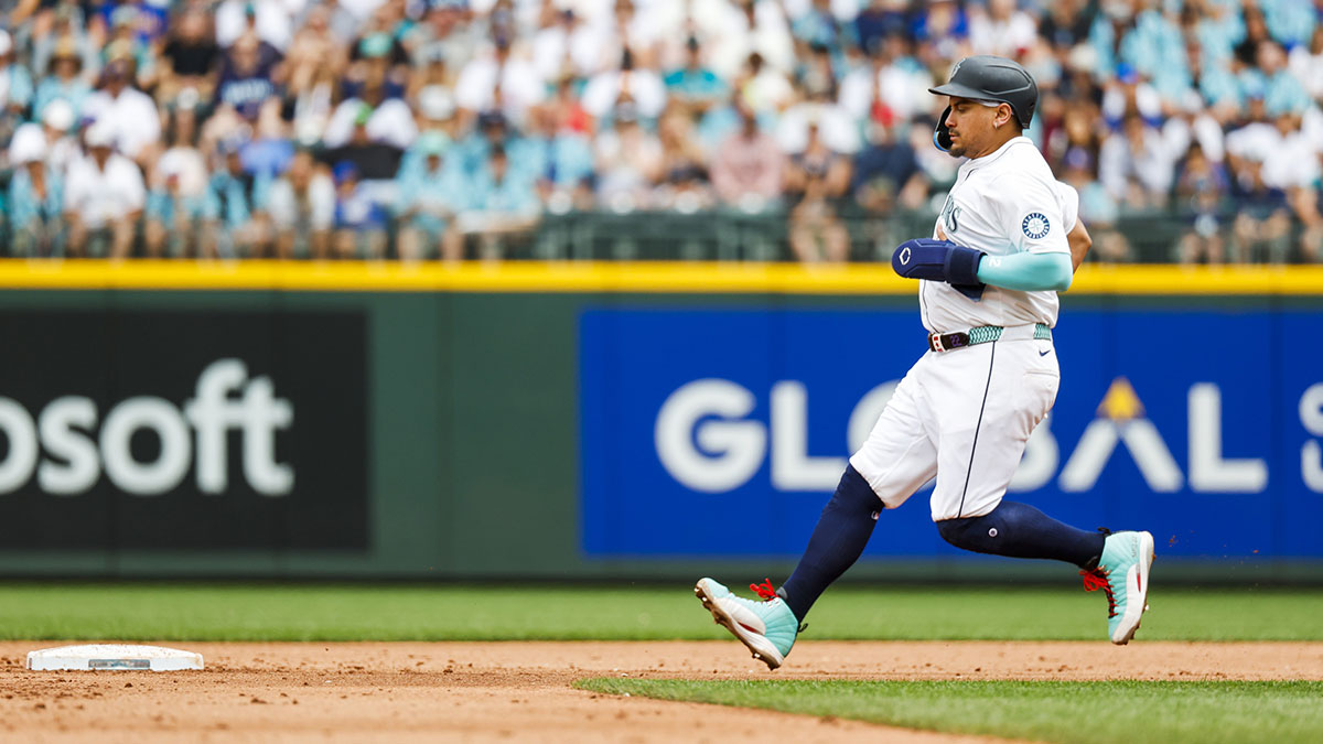 Seattle Mariners first baseman Josh Naylor (12) steals second base against the Texas Rangers during the sixth inning at T-Mobile Park.