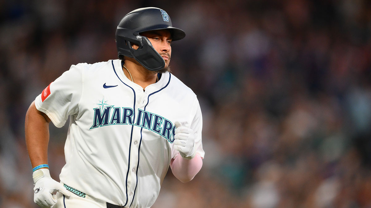 Seattle Mariners first baseman Josh Naylor (12) runs the bases after hitting a 2-run home run against the Chicago White Sox during the seventh inning at T-Mobile Park.