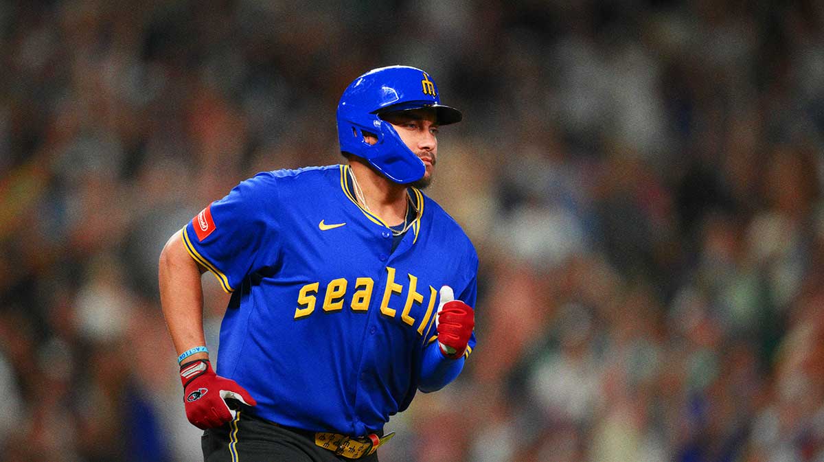 Seattle Mariners first baseman Josh Naylor (12) runs the bases after hitting a home run against the Athletics during the seventh inning at T-Mobile Park