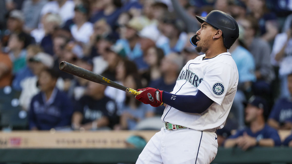 Seattle Mariners first baseman Josh Naylor (12) hits a two-run home run against the Seattle Mariners during the first inning at T-Mobile Park.