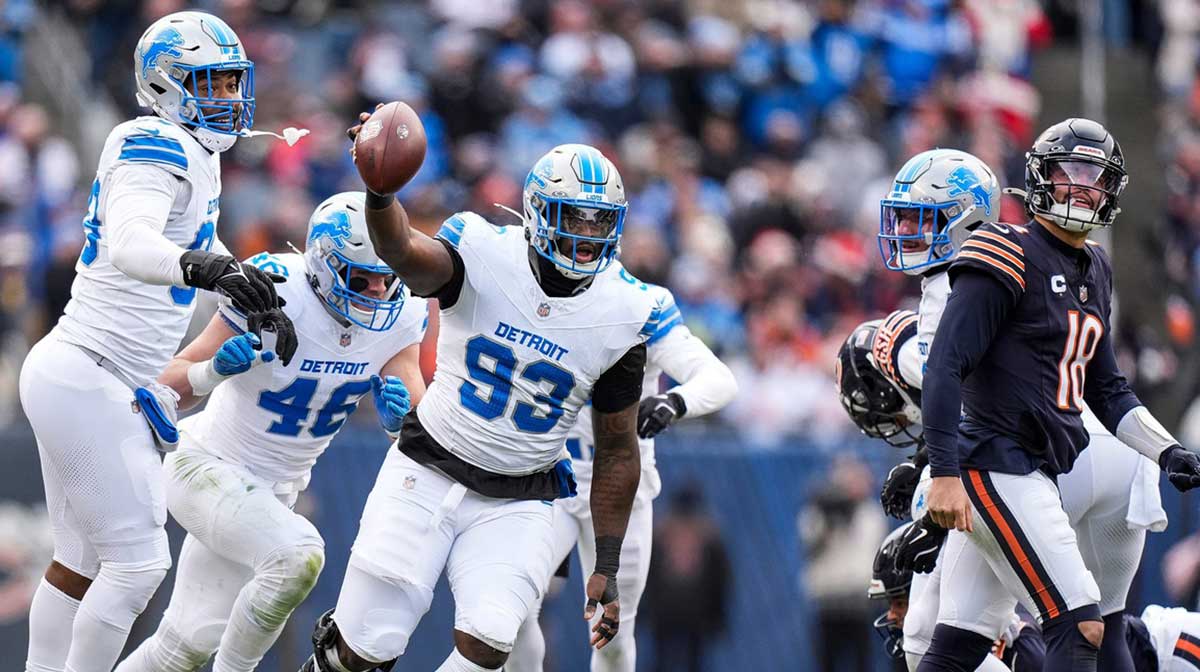 Detroit Lions defensive end Josh Paschal (93) celebrates a fumble recovery against Chicago Bears during the first half at Soldier Field in Chicago, Ill. on Sunday, Dec. 22, 2024.