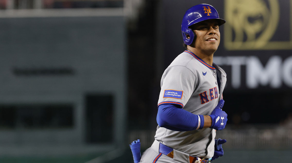 New York Mets outfielder Juan Soto (22) smiles while rounding the bases after hitting a solo home run against the Washington Nationals during the seventh inning at Nationals Park.