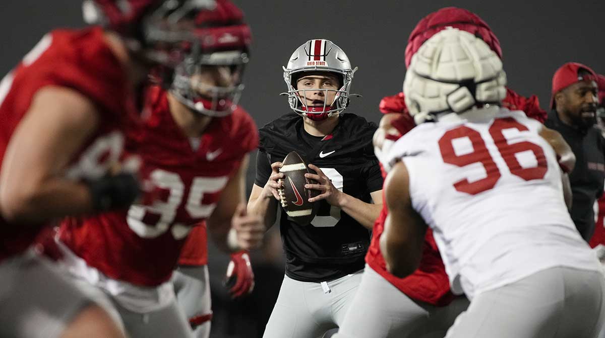 Ohio State Buckeyes quarterback Julian Sayin (10) takes a snap during spring football practice at the Woody Hayes Athletic Center
