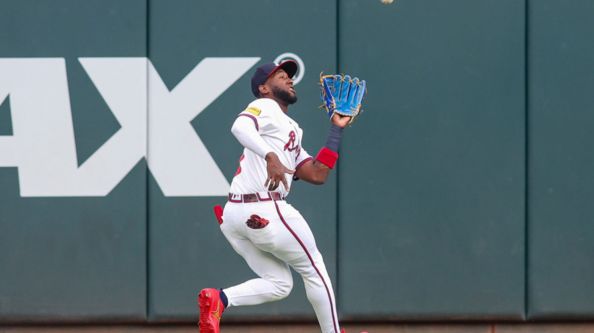 Atlanta Braves left fielder Jurickson Profar (7) catches a fly ball against the San Francisco Giants in the first inning at Truist Park.