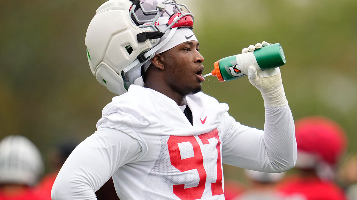 Ohio State Buckeyes defensive end Kenyatta Jackson Jr. (97) takes a drink during the first football practice of the season at the Woody Hayes Athletic Center.