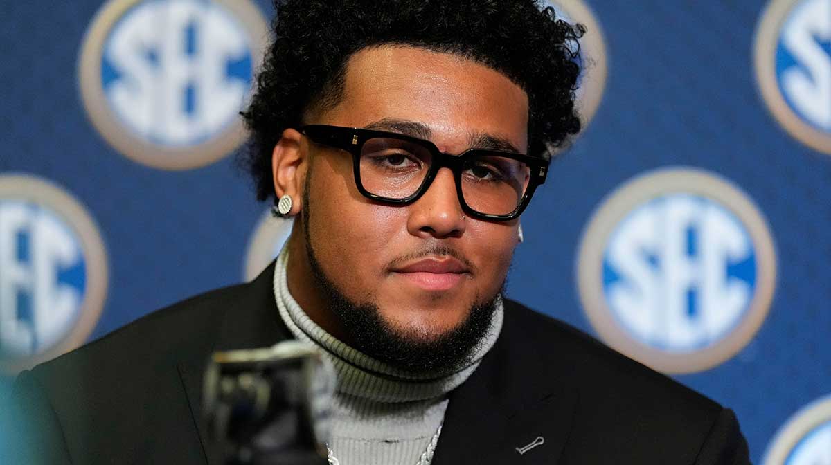 Alabama offensive lineman Kadyn Proctor listen to a question during SEC Media Days at the College Football Hall of Fame in Atlanta.