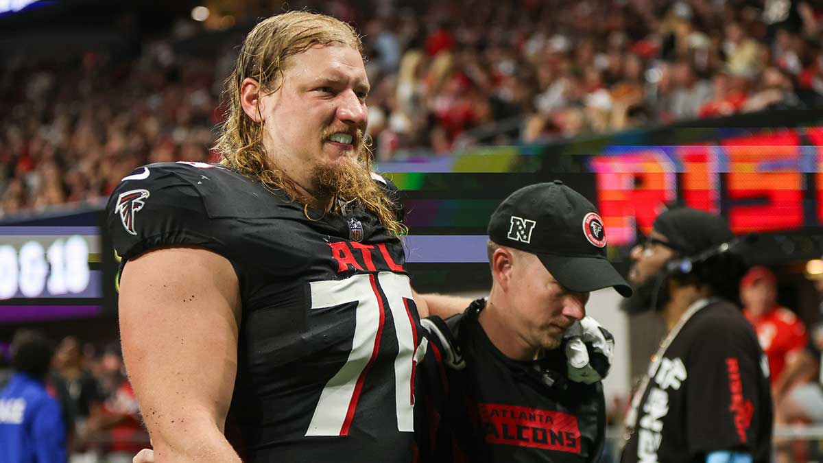 Atlanta Falcons offensive tackle Kaleb McGary (76) leaves the field with an injury against the Kansas City Chiefs in the second quarter at Mercedes-Benz Stadium.