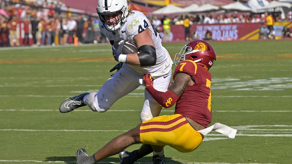 Penn State Nittany Lions tight end Tyler Warren (44) is stopped by USC Trojans safety Kamari Ramsey (7) after a short gain in the second half at United Airlines Field at the Los Angeles Memorial Coliseum.