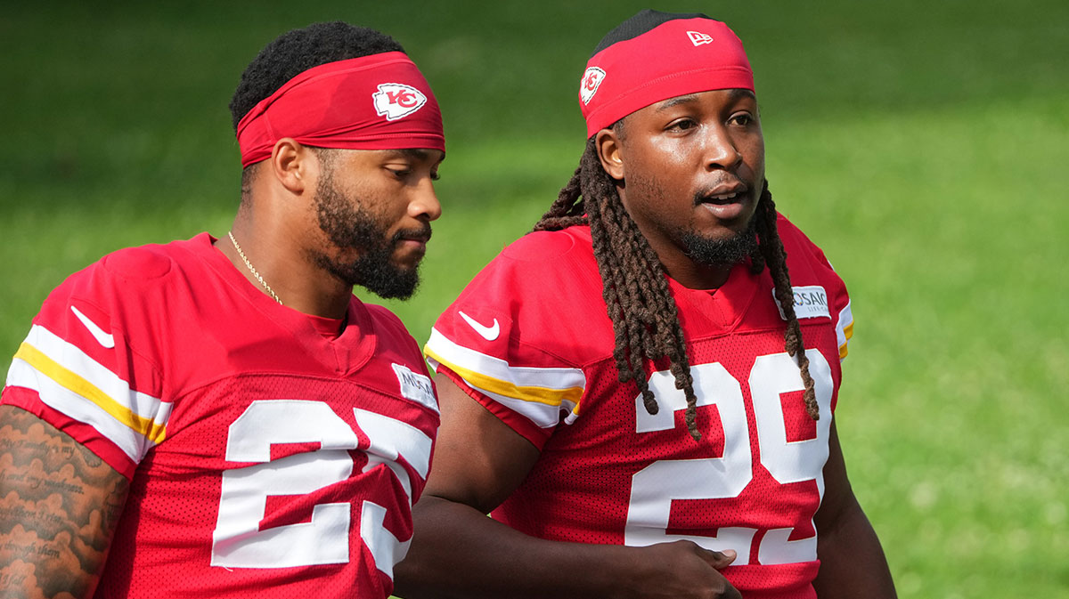 Kansas City Chiefs running backs Elijah Mitchell (25) and Kareem Hunt (29) walk down the hill to the practice fields during training camp at Missouri Western State University.
