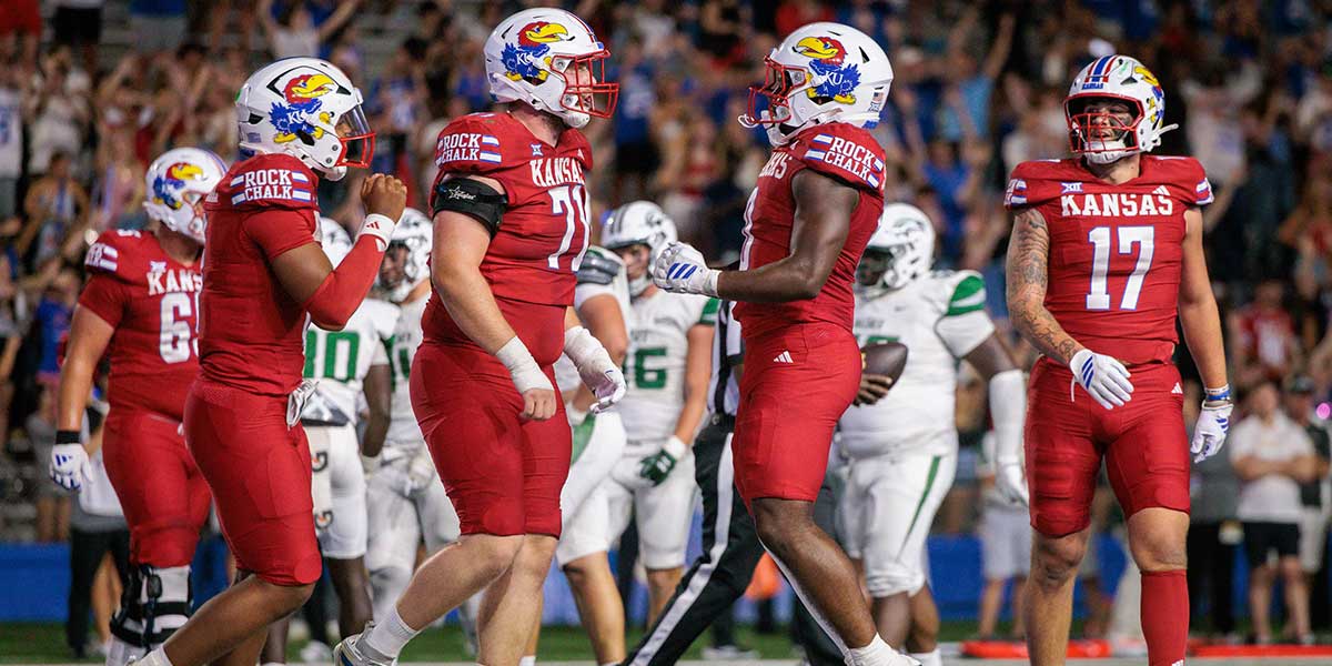 Kansas Jayhawks celebrate in the end zone after a touchdown during the second half against the Wagner Seahawks at David Booth Kansas Memorial Stadium.