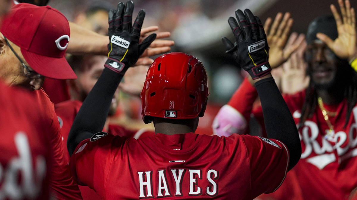 Cincinnati Reds third baseman Ke'Bryan Hayes (3) celebrates with teammates after hitting a three-run home run against the Atlanta Braves in the eighth inning at Great American Ball Park.