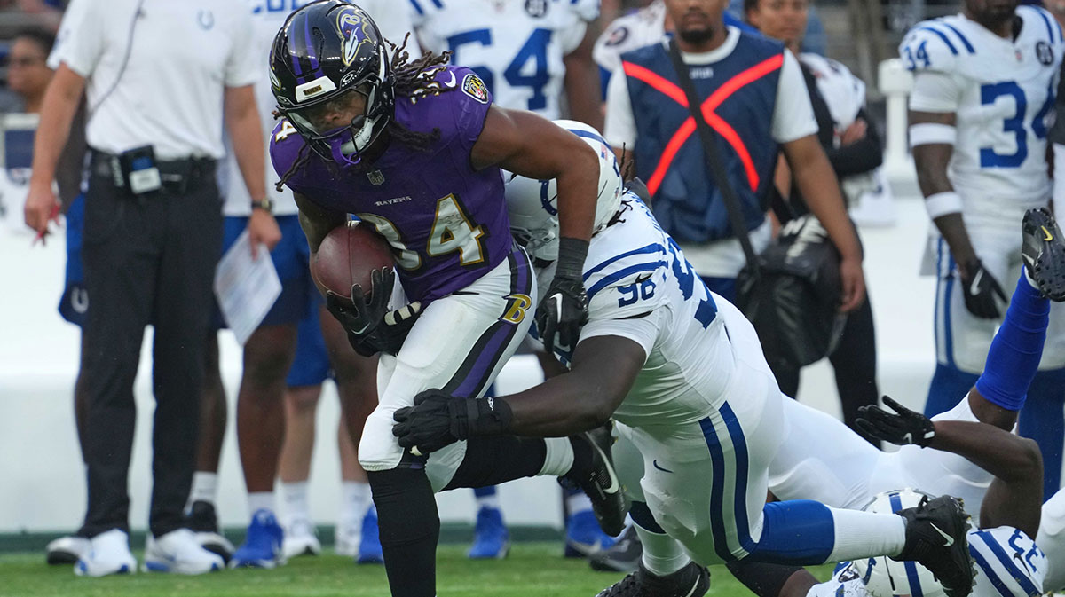 Baltimore Ravens running back Keaton Mitchell (34) runs for a gain during the first quarter against the Indianapolis Colts at M&T Bank Stadium.