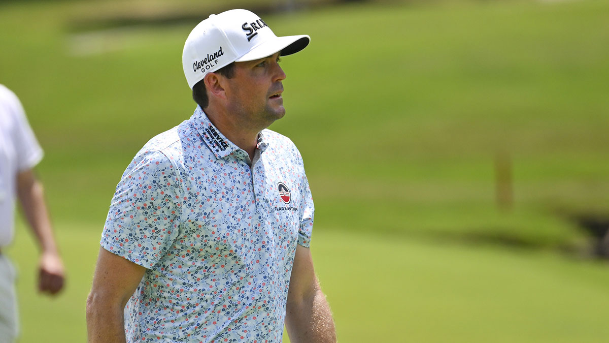 Keegan Bradley walks up the eighteenth fairway during the first round of the FedEx St. Jude Championship golf tournament.