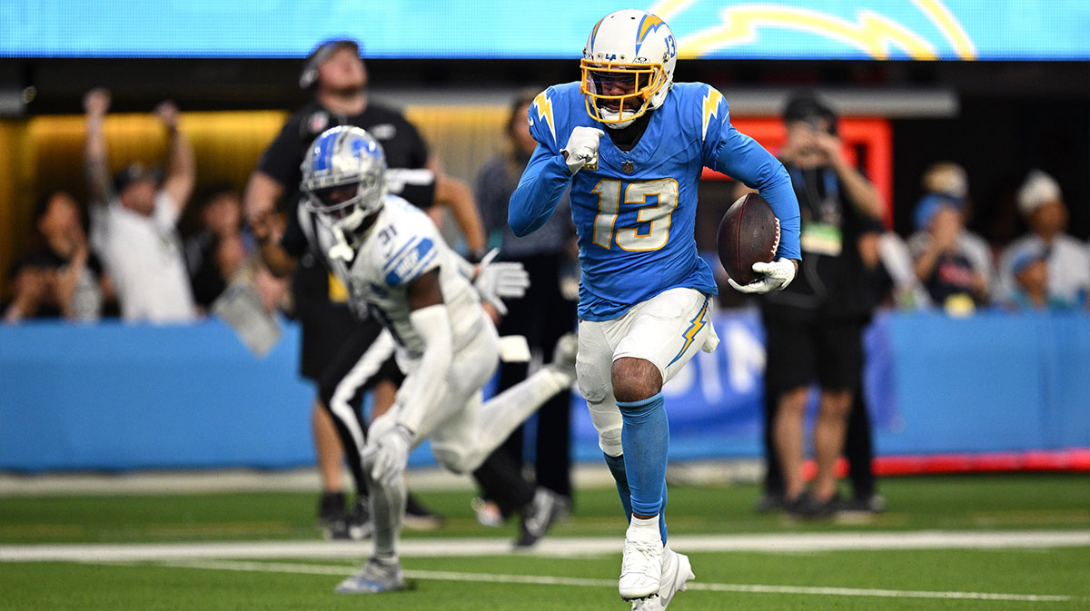 Los Angeles Chargers wide receiver Keenan Allen (13) runs the ball for a touchdown after a catch against the Detroit Lions during the second half at SoFi Stadium.