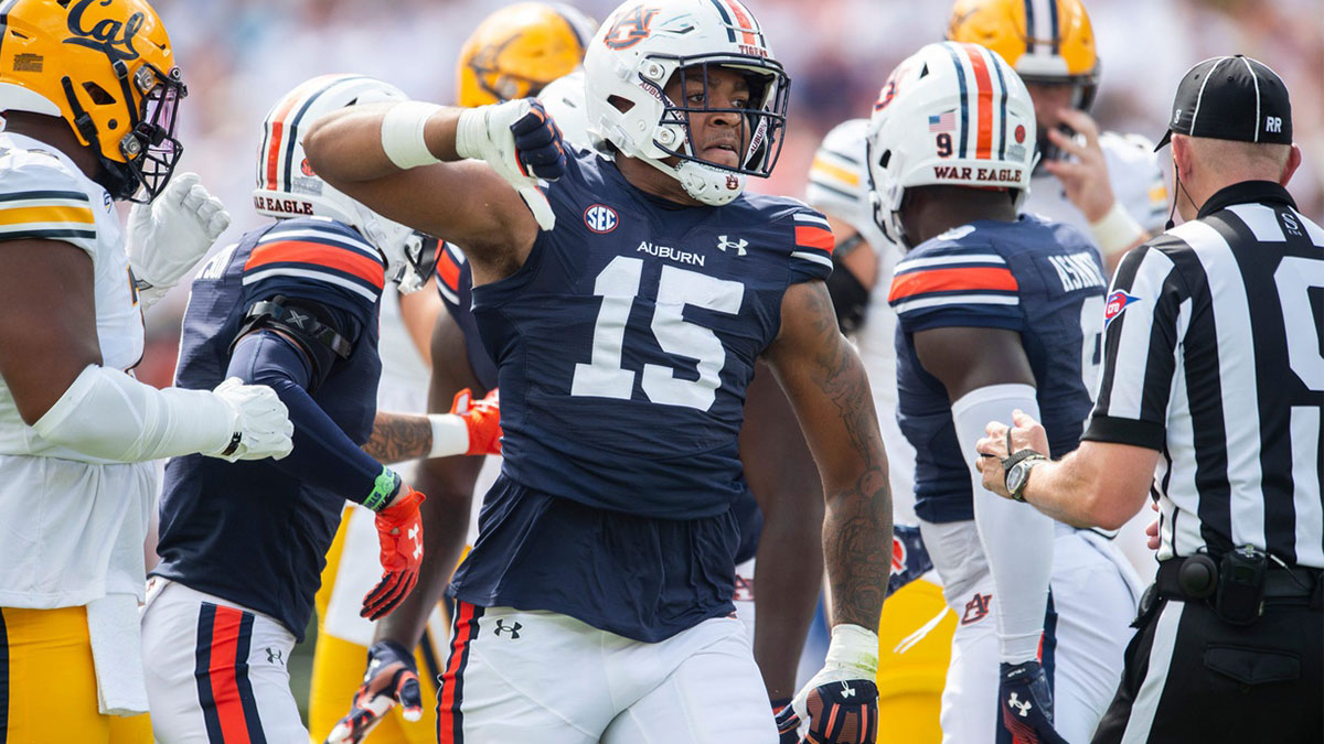 Auburn Tigers defensive lineman Keldric Faulk (15) celebrates a stop as Auburn Tigers take on California Golden Bears at Jordan-Hare Stadium