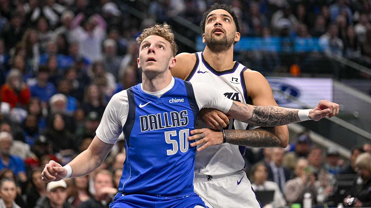 Dallas Mavericks center Kylor Kelley (50) and Sacramento Kings forward Trey Lyles (41) look for the ball during the second half at the American Airlines Center.