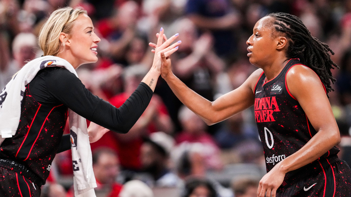 Indiana Fever guard Sophie Cunningham (8) high-fives Indiana Fever guard Kelsey Mitchell (0) on Saturday, Aug. 9, 2025, during a game between the Indiana Fever and the Chicago Sky.