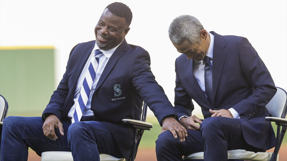 Seattle Mariners former outfielder Ichiro Suzuki, right, reacts with outfielder Ken Griffey, Jr., left, during a ceremony to retire his number before a game against the Tampa Bay Rays at T-Mobile Park.