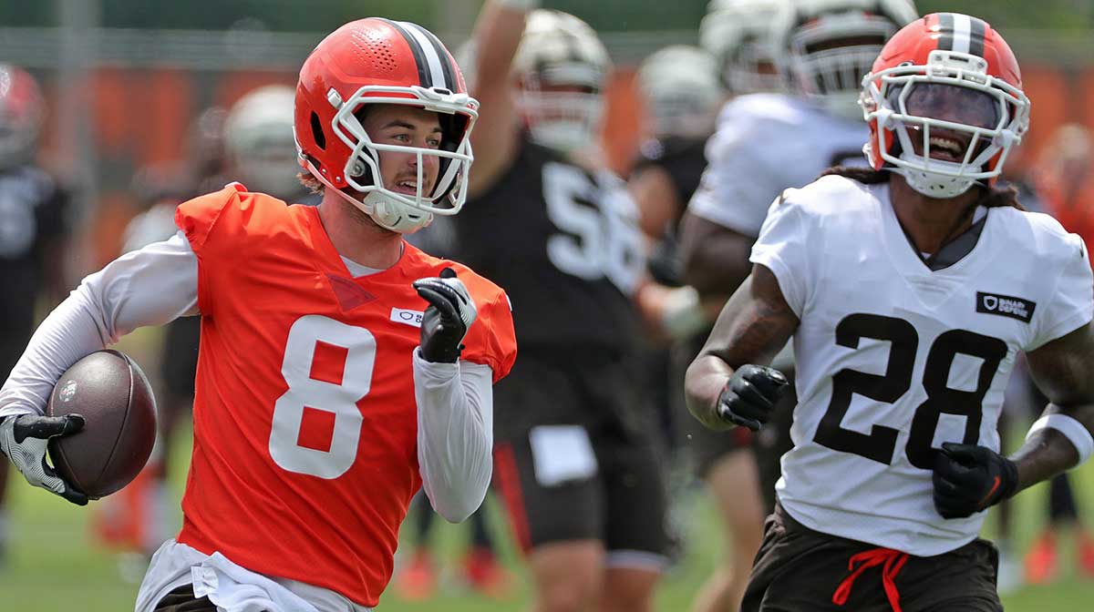 Cleveland Browns quarterback Kenny Pickett (8) runs for a touchdown as safety Rayshawn Jenkins (28) gives chase during training camp July 25, 2025, in Berea, Ohio.