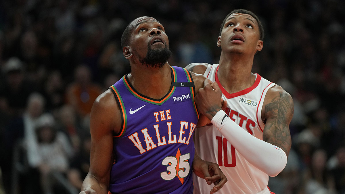 Phoenix Suns forward Kevin Durant (35) and Houston Rockets forward Jabari Smith Jr. (10) fight for position in the first half at Footprint Center.