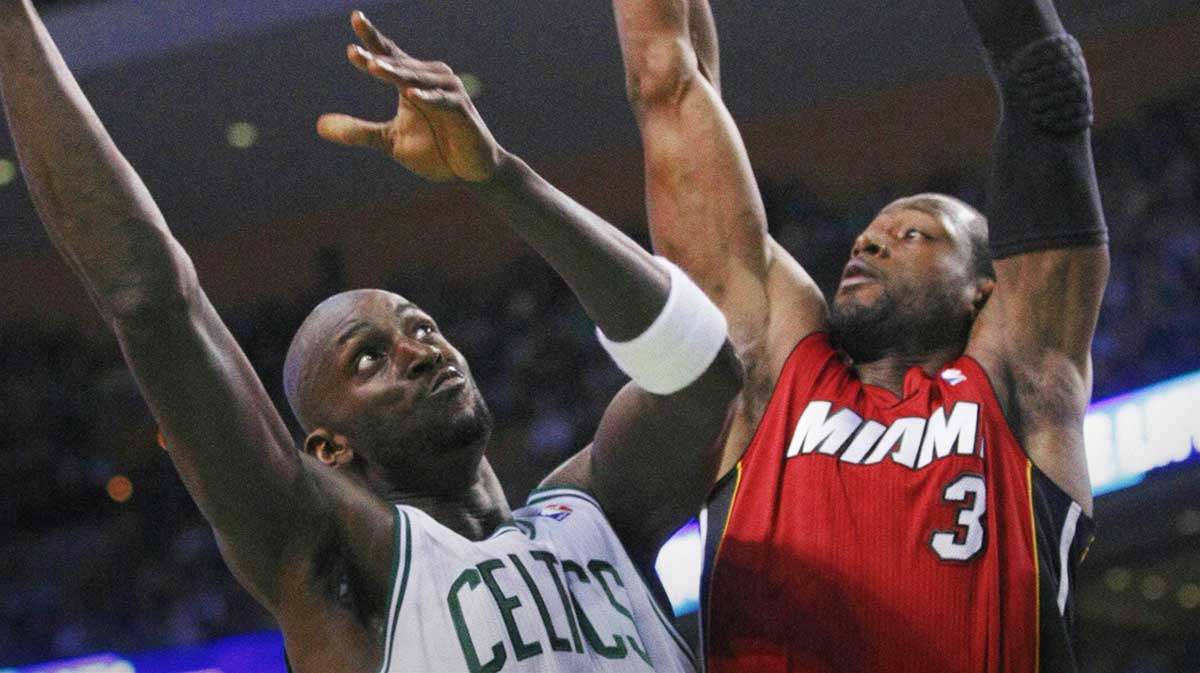 Boston Celtics power forward Kevin Garnett (5) shoots against Miami Heat shooting guard Dwyane Wade (3) in game three of the second round of the 2011 NBA playoffs at TD Garden.