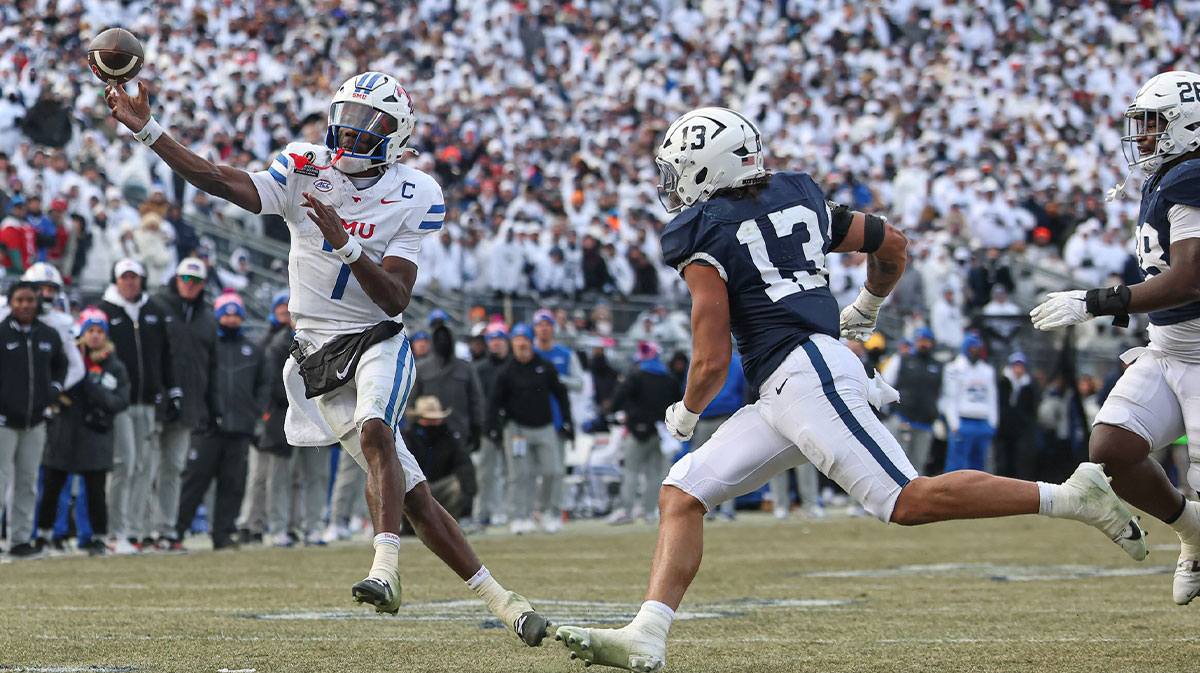 Southern Methodist Mustangs quarterback Kevin Jennings (7) throws the ball asPenn State Nittany Lions linebacker Tony Rojas (13) pursues during the second half at Beaver Stadium.