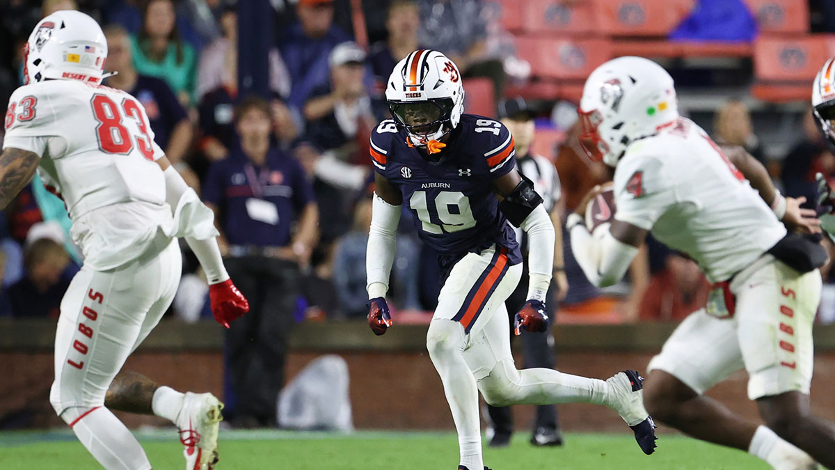 Auburn Tigers safety Sylvester Smith (19) chases down New Mexico Lobos quarterback Devon Dampier (4) during the third quarter at Jordan-Hare Stadium.