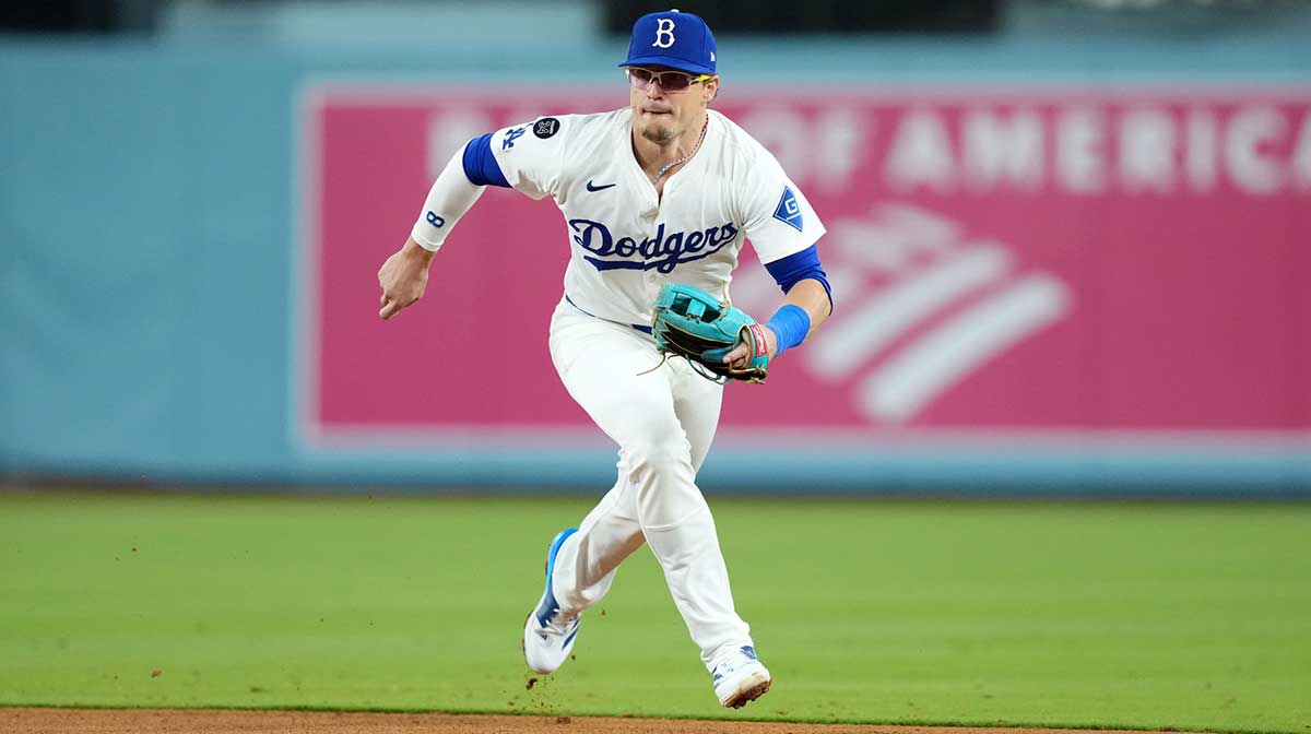 Los Angeles Dodgers second baseman Kike Hernandez (8) fields a ground ball in the ninth inning against the Colorado Rockies at Dodger Stadium.