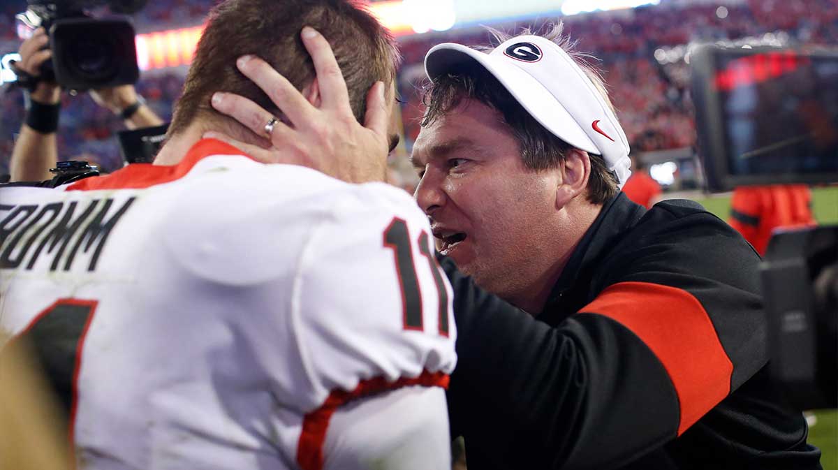 Georgia coach Kirby Smart celebrates with Georgia quarterback Jake Fromm (11) after getting a win in a NCAA football game between Georgia and Florida in Jacksonville,