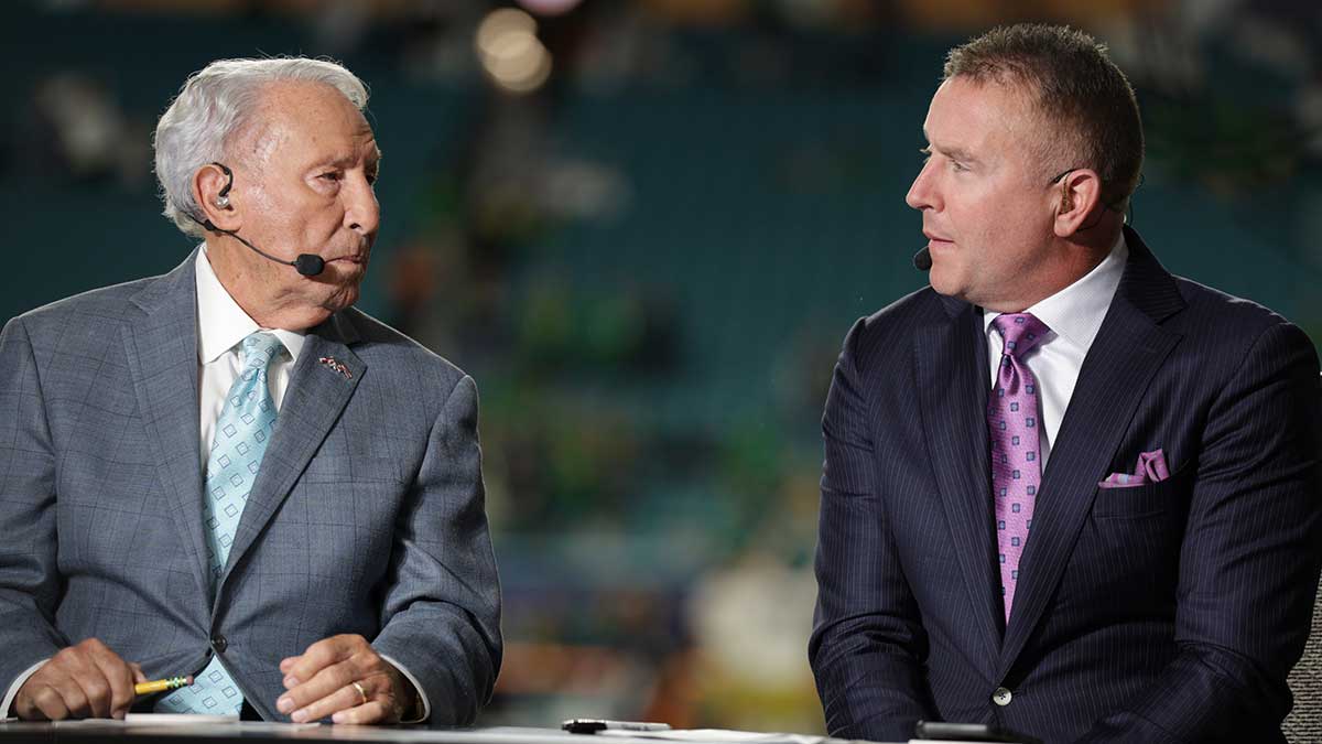 ESPN analysts Lee Corso and Kirk Herbstreit before the game between the Notre Dame Fighting Irish and the Penn State Nittany Lions in the Orange Bowl at Hard Rock Stadium.