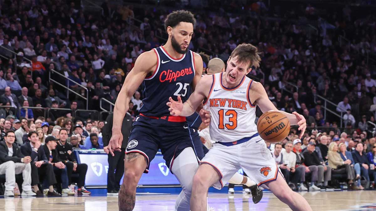New York Knicks guard Tyler Kolek (13) looks to drive past LA Clippers guard Ben Simmons (25) in the third quarter at Madison Square Garden.