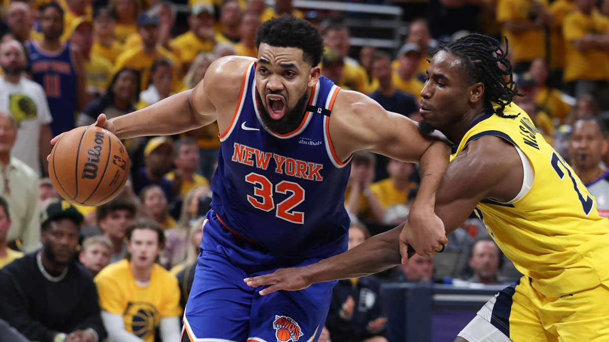 Knicks center Karl-Anthony Towns (32) drives to the basket against Indiana Pacers guard Andrew Nembhard (2) in the third quarter during game six of the eastern conference finals for the 2025 NBA Playoffs at Gainbridge Fieldhouse