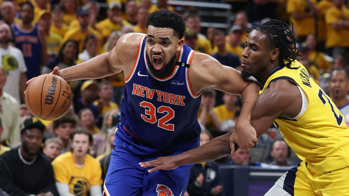 Knicks center Karl-Anthony Towns (32) drives to the basket against Indiana Pacers guard Andrew Nembhard (2) in the third quarter during game six of the eastern conference finals for the 2025 NBA Playoffs at Gainbridge Fieldhouse